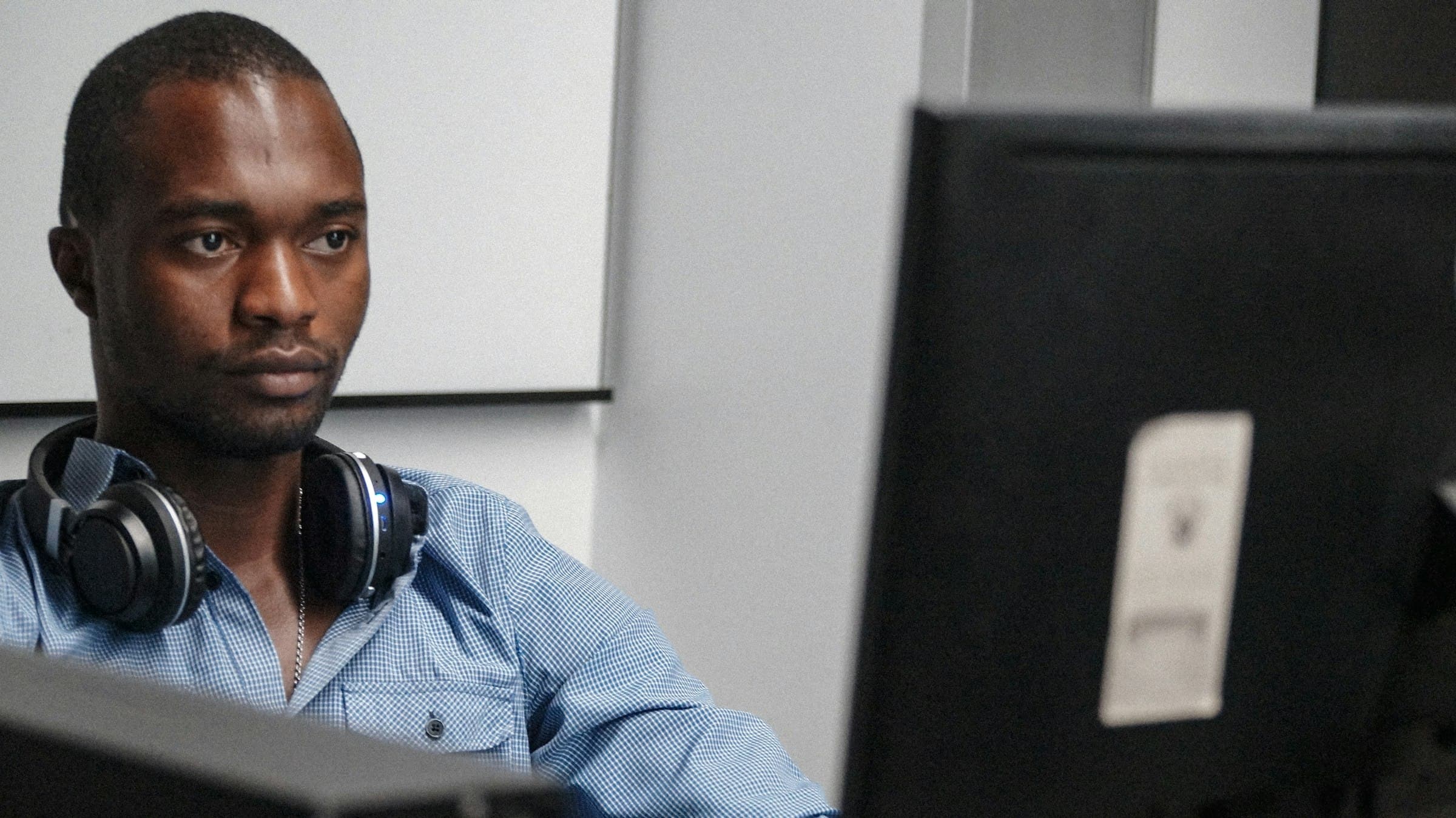 Astro Tech support specialist at his workstation